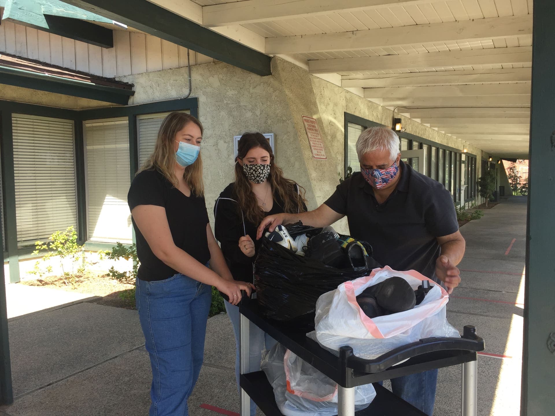 Volunteers sorting donated shoes and clothing for neighbors in need