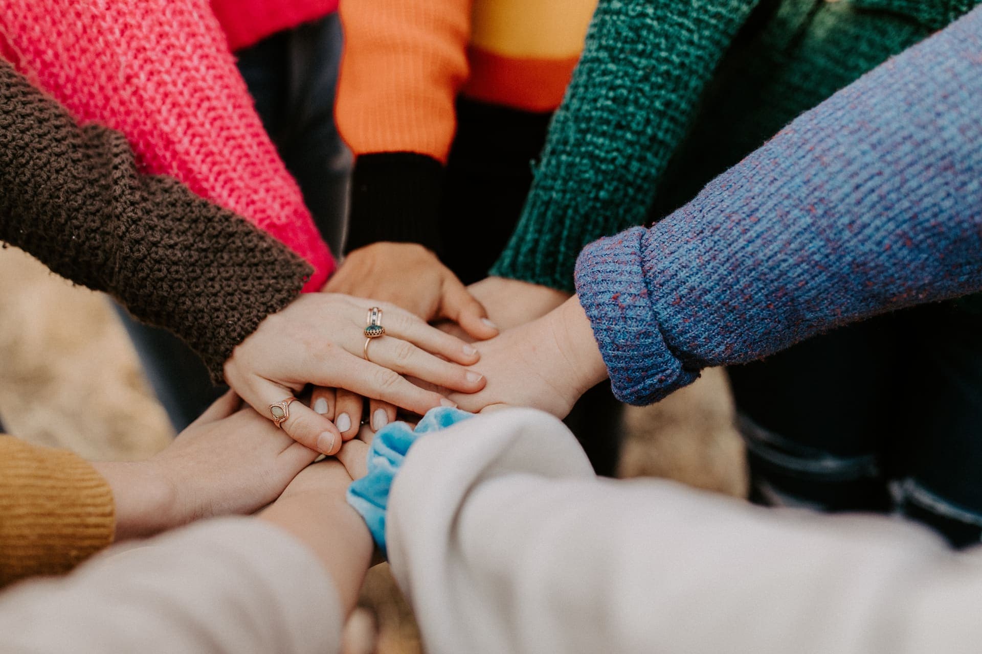 Hands joined together in community